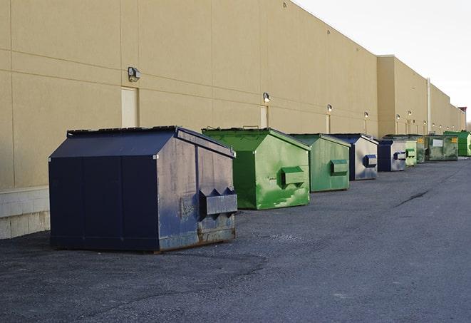 portable, green construction dumpsters serving as a container for scrap materials in Crown Point